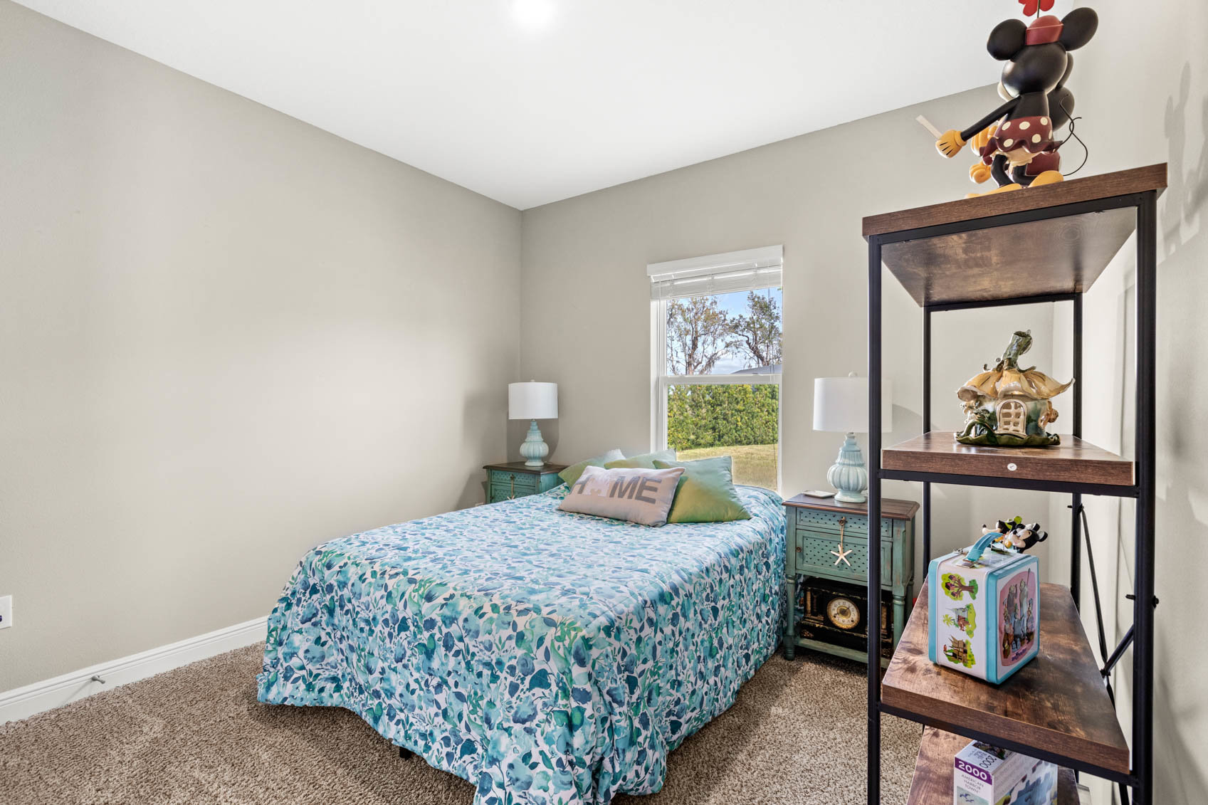 bedroom with full size bed and blue comforter
